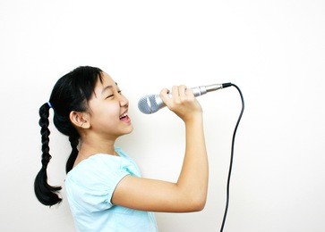young asian girl singing.