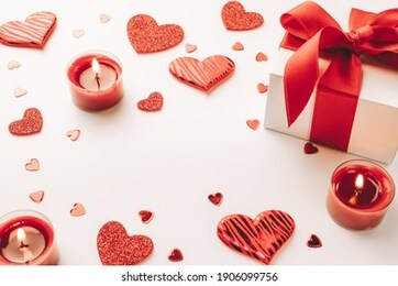 happy days background. red love hearts, romantic gift box, valentines day candle on white table. romantic message template with copy space