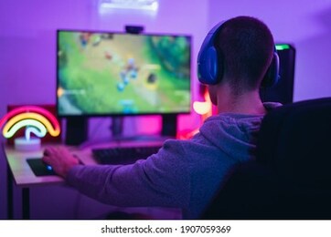 young gamer playing online video games while streaming on social media - youth people addicted to new technology game
