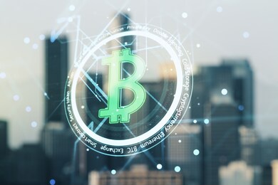 double exposure of creative bitcoin symbol hologram on blurry cityscape background. cryptocurrency concept