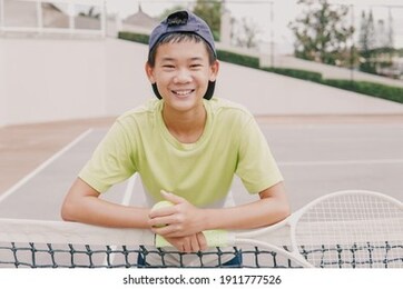 asian preteen tween boy playing tennis,  healthy young athletes training, active wellbeing concept