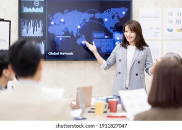 corporate teamwork - young asian busineswoman lead group of business startup team in strategic meeting presentation