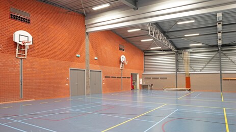 interior of a large school gym hall, no children