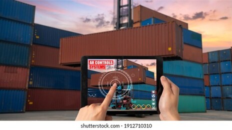 engineer use augmented reality software in cargo container yard with automated application . futuristic machinery in working in concept of industry 4.0 or 4th industrial revolution.