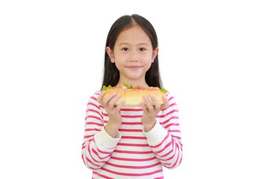portrait asian little child girl eating hot dog isolated on white background.