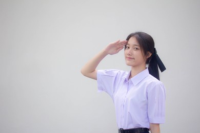 asia thai high school student uniform beautiful girl salute