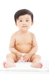 infant child baby sitting on a white background