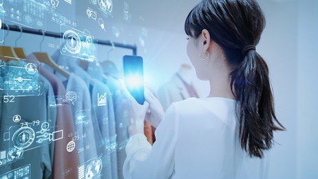 woman scanning products with a smart phone. retail as a service. raas.