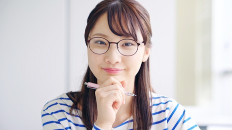 young asian female student in classroom.