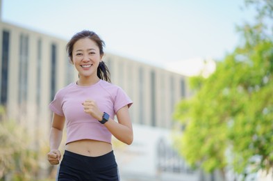 asian women running exercise in the morning.
