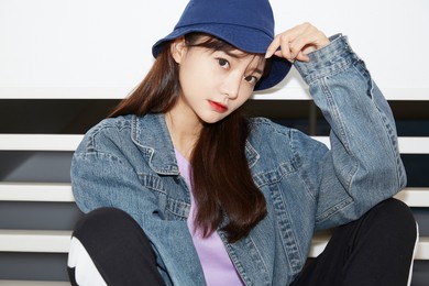 portrait of a asian young woman wearing street fashion