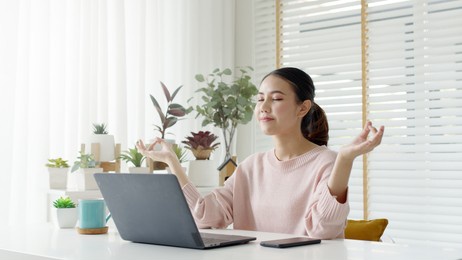 attractive beautiful young asia female close eyes maditate at home self break stress relief from work, stay quarantine social distance in online yoga class community, wellness wellbeing lifestyle.