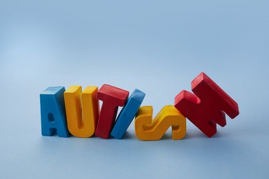 autism awareness concept. word autism on blue background.