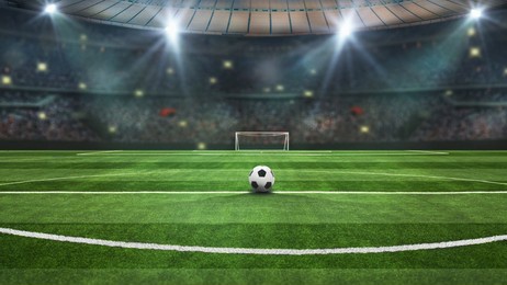 ball in green field in soccer stadium. ready for game in the mid