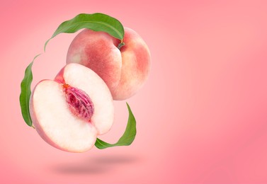 fresh white peach fruit with leaf isolated on peach colour background with clipping path,
