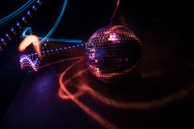 colorful disco mirror ball lights night club background. party lights disco ball. selective focus