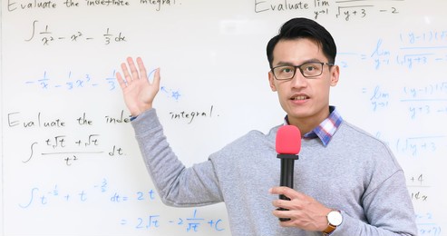 asian male professor teach calculus online through webcam in classroom