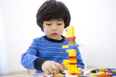 the image of cute asian kid with lego