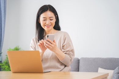 a woman in her 40s working from home