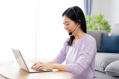 asian woman talking at home