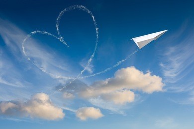 heart made with an paper plane 