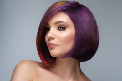 beautiful woman with multi-colored hair and creative make up and hairstyle. beauty face.