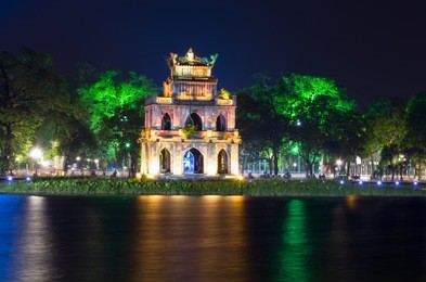 turtle tower at night on hoan kiem lake. hanoi, vietnam.