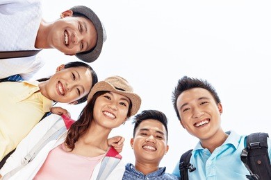 group of happy friends bonding together