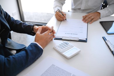 business people signing contract making a deal with real estate agent concept for consultant and home insurance. 
real estate investment property insurance and security. real estate agent offer 