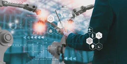 industry engineer in factory,using smart tablet glass device,control automated robot arm machine learning operation,concept business and industry 4.0,artificial intelligence or ai,with 5g network