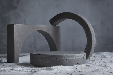 background for cosmetic products grey concrete scene with geometric shapes. concrete round and arc grey podium. empty showcase for packaging product presentation. mock up pedestal.
