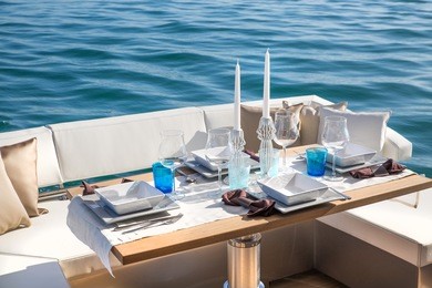 lunch on motor yacht, table setting at a luxury yacht.