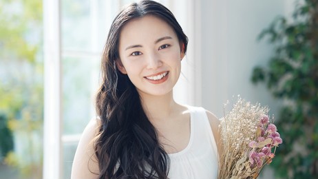 young asian woman holding bouquet. beauty concept. skin care. body care. 