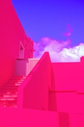 fashion tropical location. bright pink hotel. blue sky. canary islands. travel advertising concept