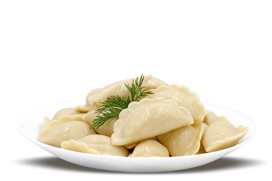 boiled dumplings on a white plate close-up. russian cuisine. isolated image.