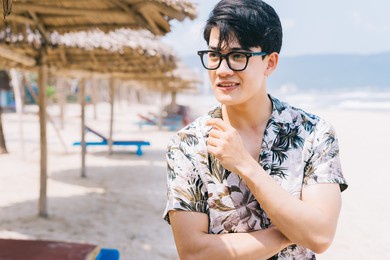 portrait of asian man on the beach
