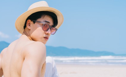 portrait of asian man on the beach