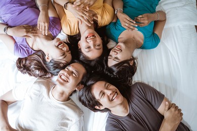 five asian young friend having fun together in the bedroom