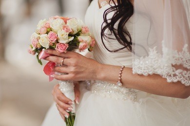 bouquet in the hands of the beautiful bride. wedding theme.