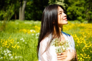 beautiful asian young woman resting on nature