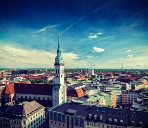vintage retro effect filtered hipster style travel image of aerial view of munich and st. peter church  - marienplatz and altes rathaus, bavaria, germany