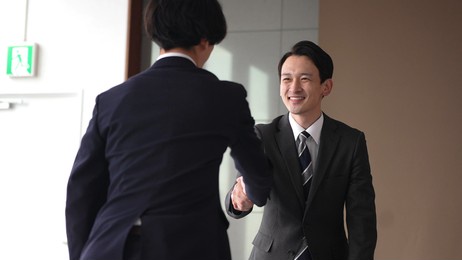 asian businessmen shaking hands in the office