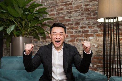 excited young asian business man feeling happy receiving new job opportunity, reward bonus, celebrates financial market growth concept amazed man shocked, show ok. handsome guy surprised to camera