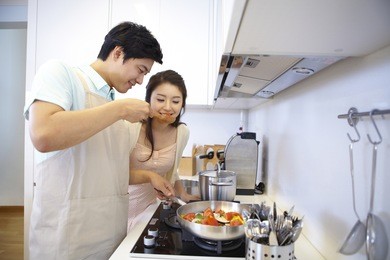 the image of a happy asian family cooking