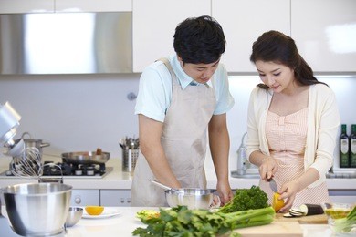the image of a happy asian family cooking