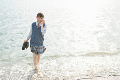 high school girl on the phone at sea