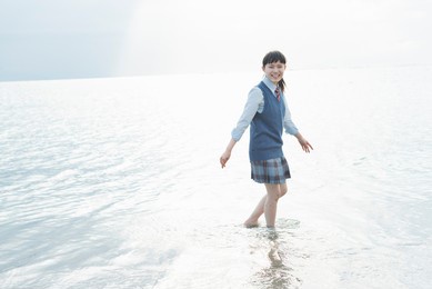 high school girls playing in the sea