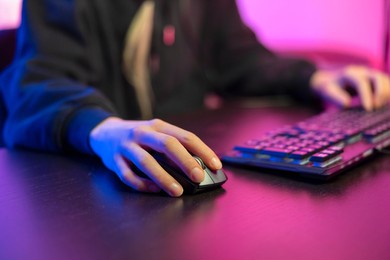 close up of pro cyber sport gamer play game with keyboard and mouse