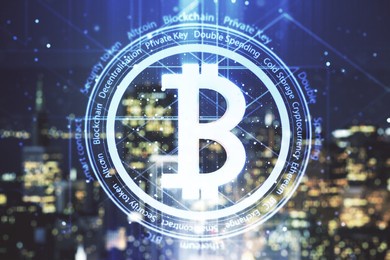 virtual bitcoin hologram on blurry skyline background. multiexposure