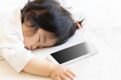 baby sleeping prone and smartphone (0 years old, 9 months old, japanese, girl)